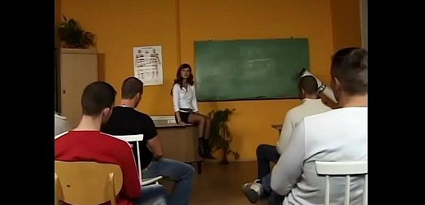  Horny teacher shows striptease on the table and gives a blowjob to all students in the class